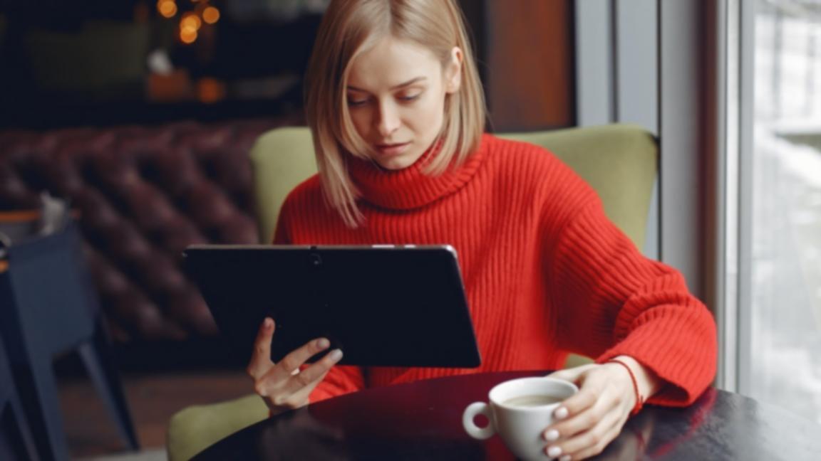 Professional video editing workspace with multiple screens showing timeline and color grading panels