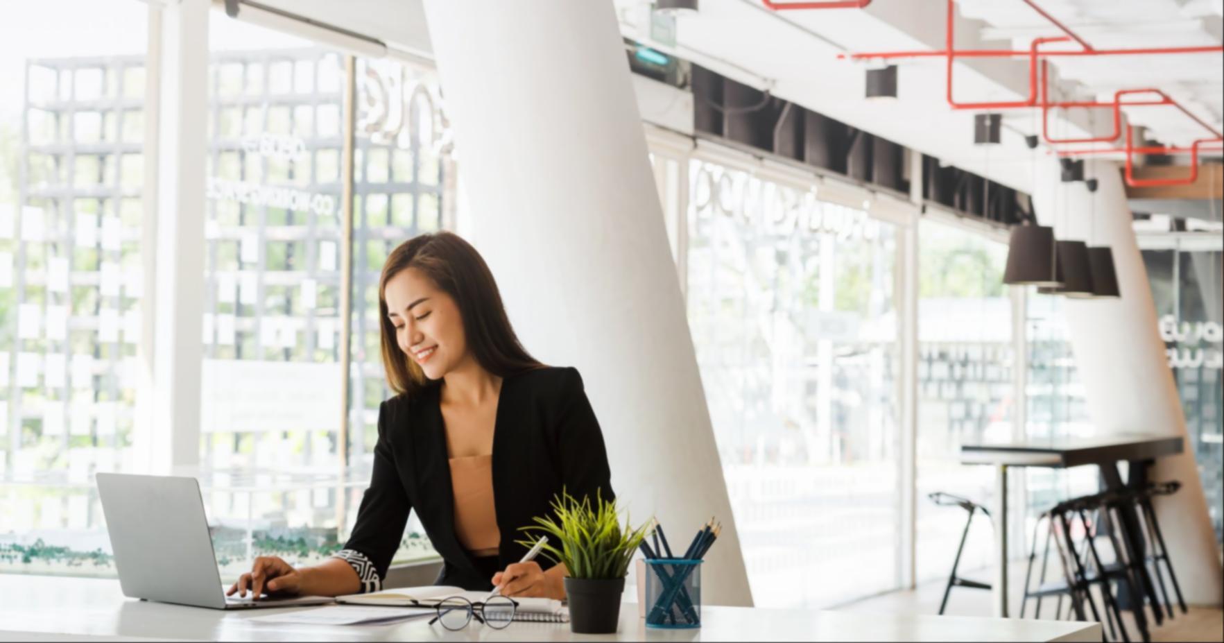 Instructor providing one-on-one editing feedback during hands-on workshop session