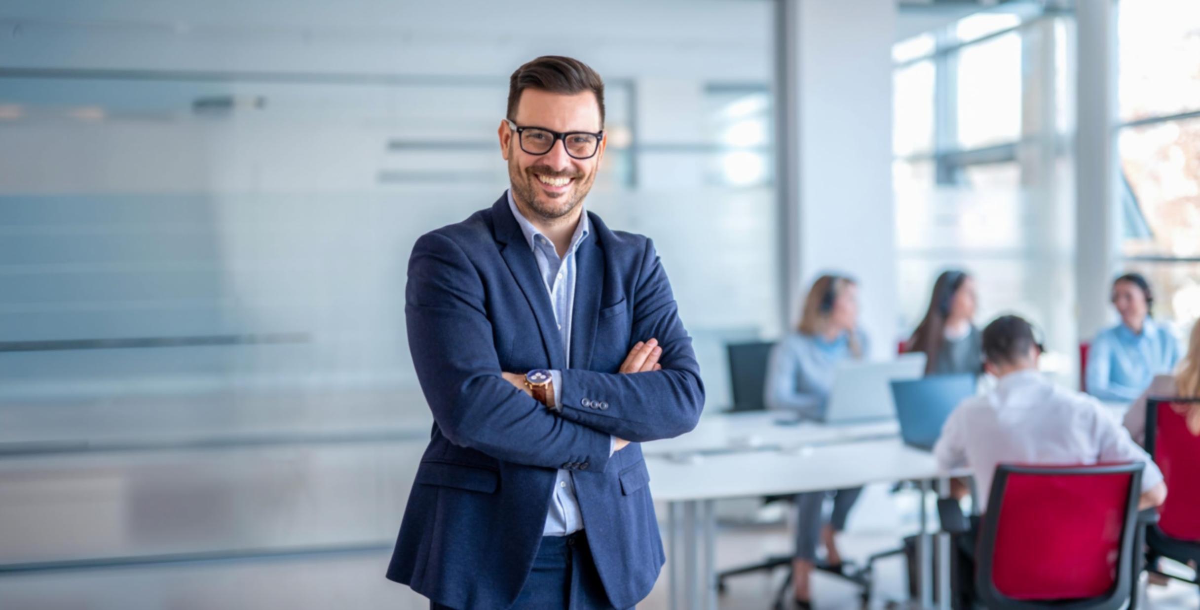 Instructor reviewing student's video editing project on professional editing suite