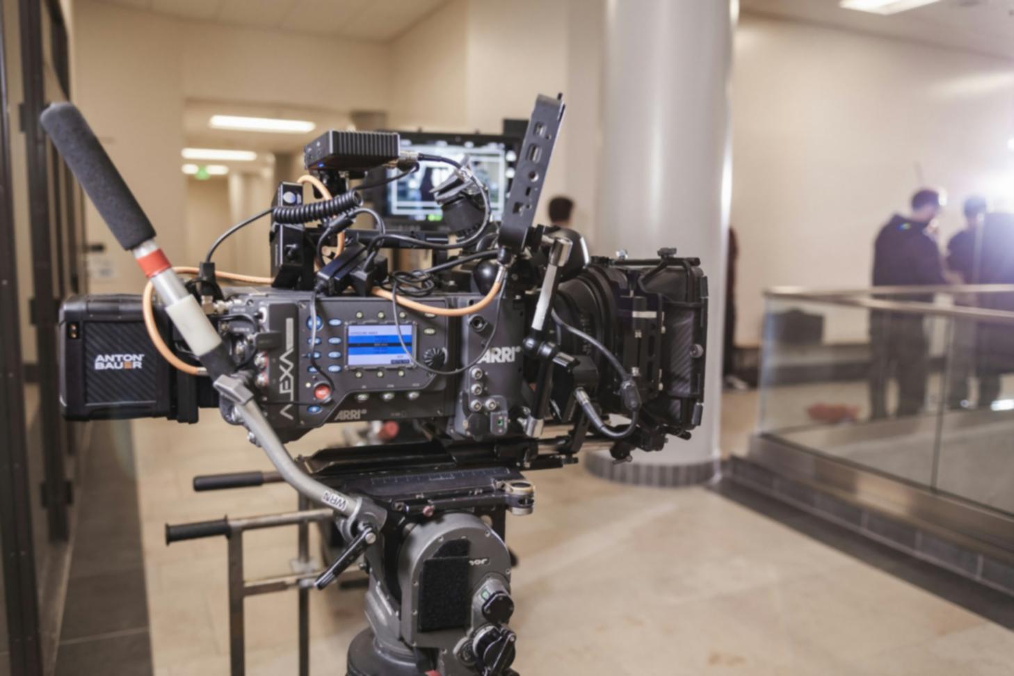 Student reviewing audio waveforms and video footage during editing session